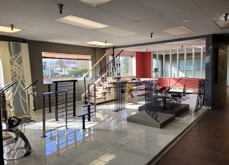 Interior view of the Custom Railings WA showroom in Kent, WA, showcasing modern and ornamental metal railings, glass railings, fences, gates and other metalwork.