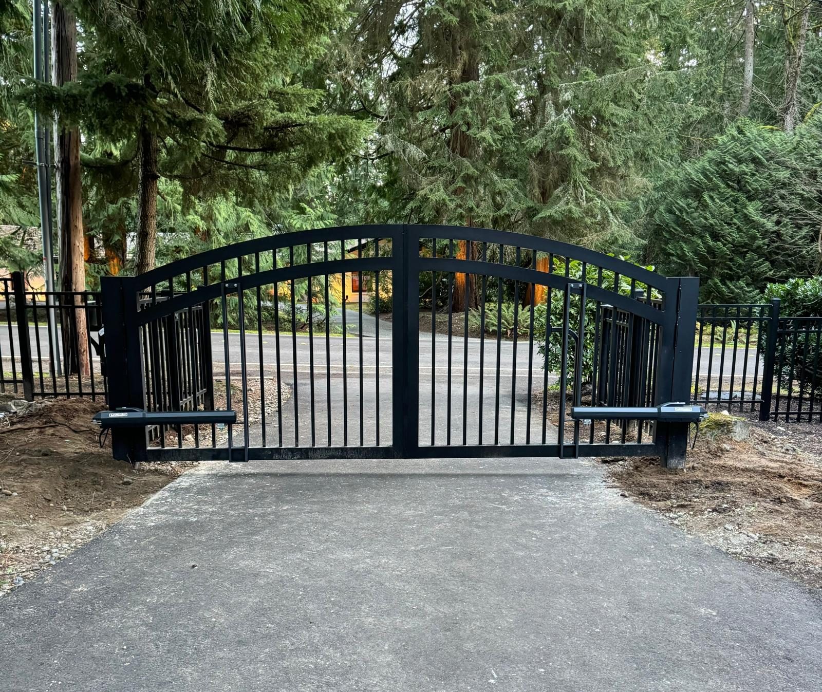 Black arched automated gate installed in Bellevue by Fences & Gates Pro and Custom Railings WA