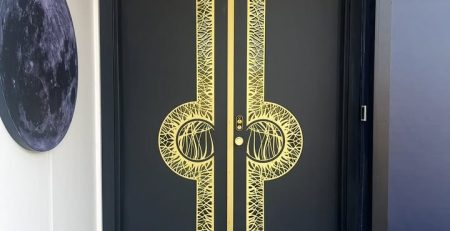 Luxury custom front door with brass and aluminum detailing in Bothell, WA