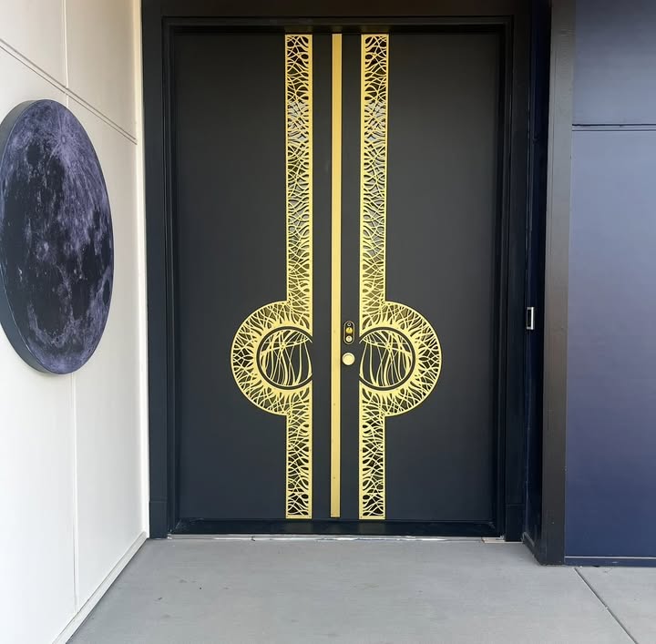 Luxury custom front door with brass and aluminum detailing in Bothell, WA