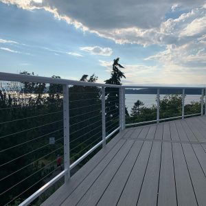 White cable deck railings with stainless horizontal cables overlooking water in Mukilteo WA