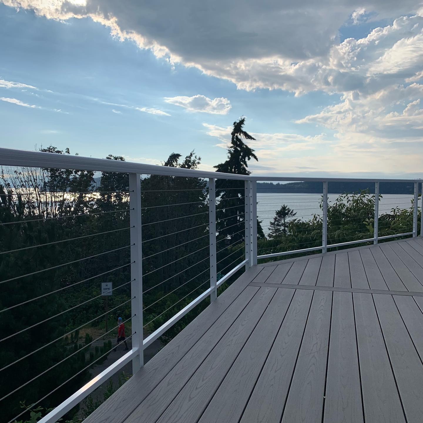 White cable deck railings with stainless horizontal cables overlooking water in Mukilteo WA