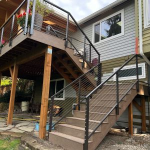 Exterior deck cable railing system with metal posts and stainless cables