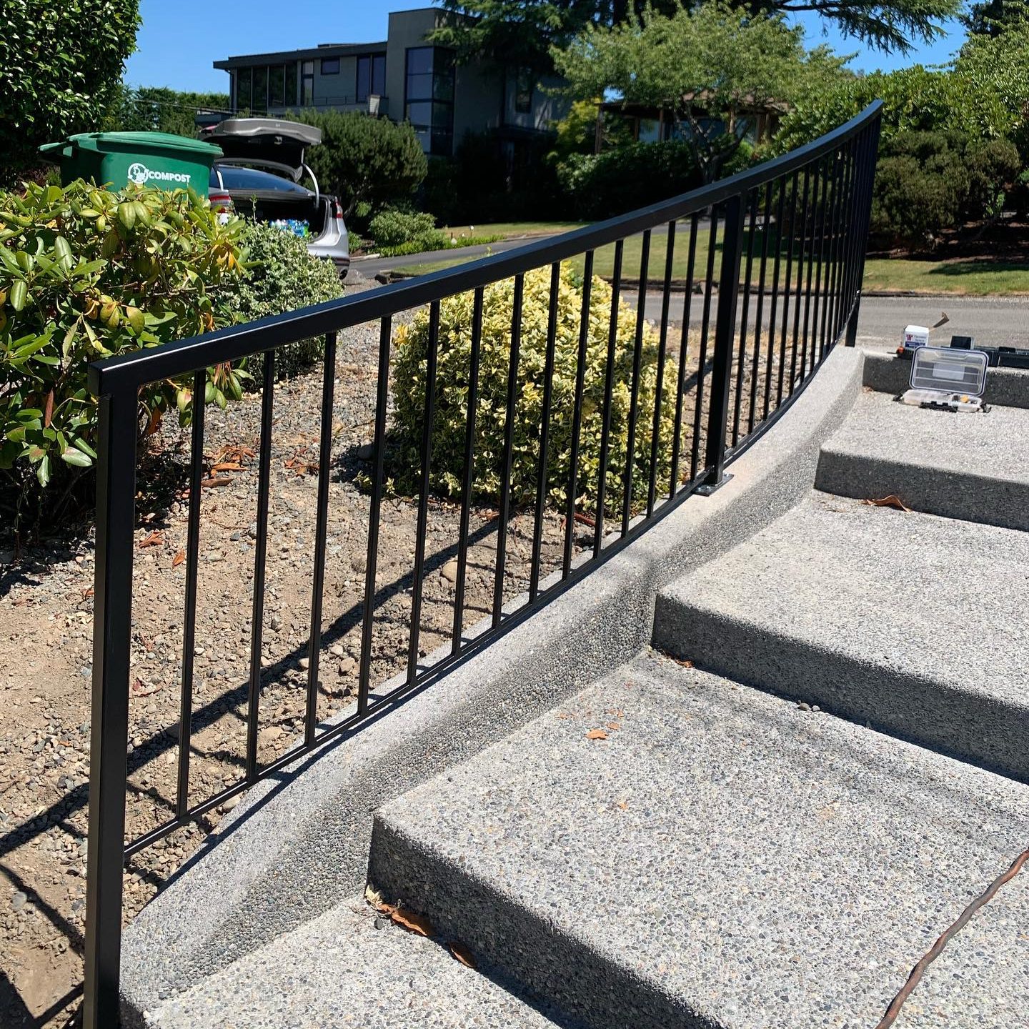 Black metal picket railing for exterior concrete stairs in Mercer Island, WA