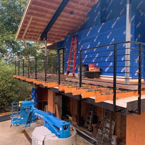 Modern black metal deck railings installed on an elevated deck in Mercer Island WA
