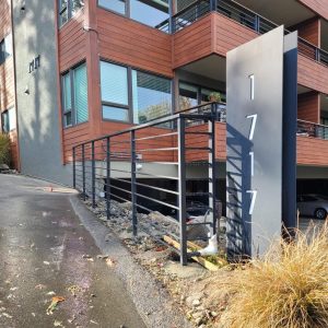 Commercial-grade exterior railings installed on a building walkway or ramp