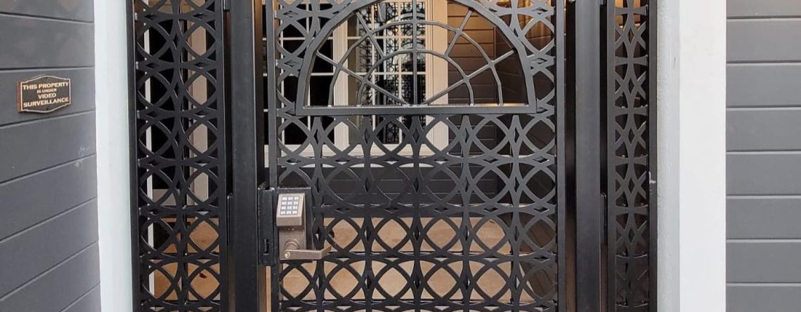 Decorative black metal security entry gate with geometric laser-cut pattern in Tacoma