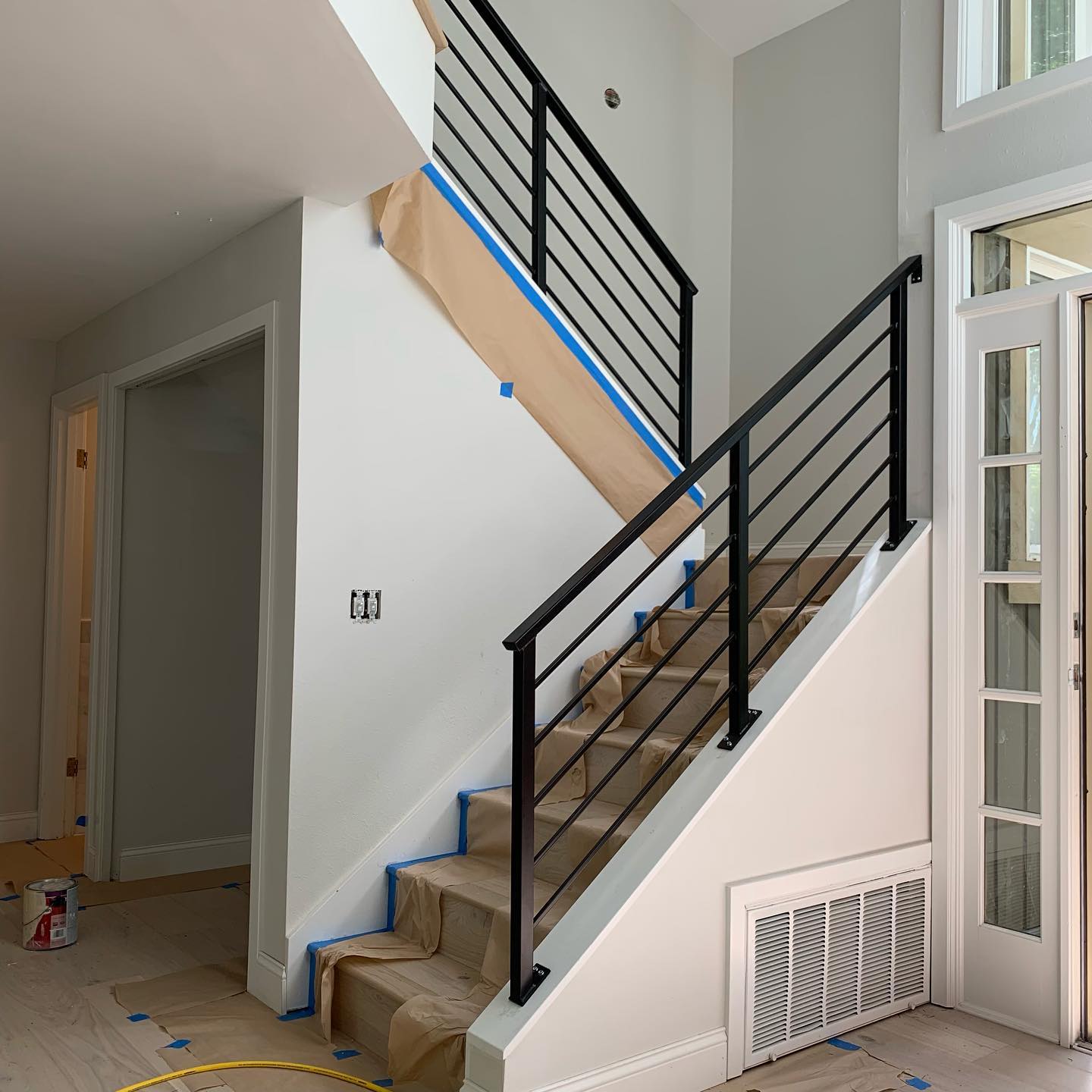 Black interior stair railing system installed during a remodel in Mercer Island WA