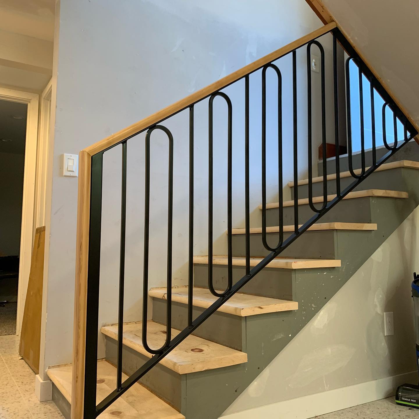 Black interior stair railings with horizontal bars installed in Seattle WA