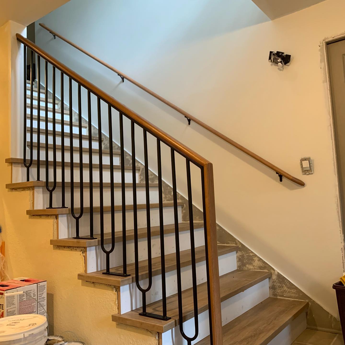 Interior railing system with black metal and modern geometry in Woodinville WA