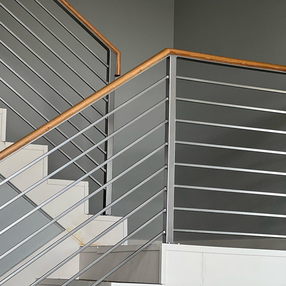 Modern stair railings installed indoors with sleek metal design