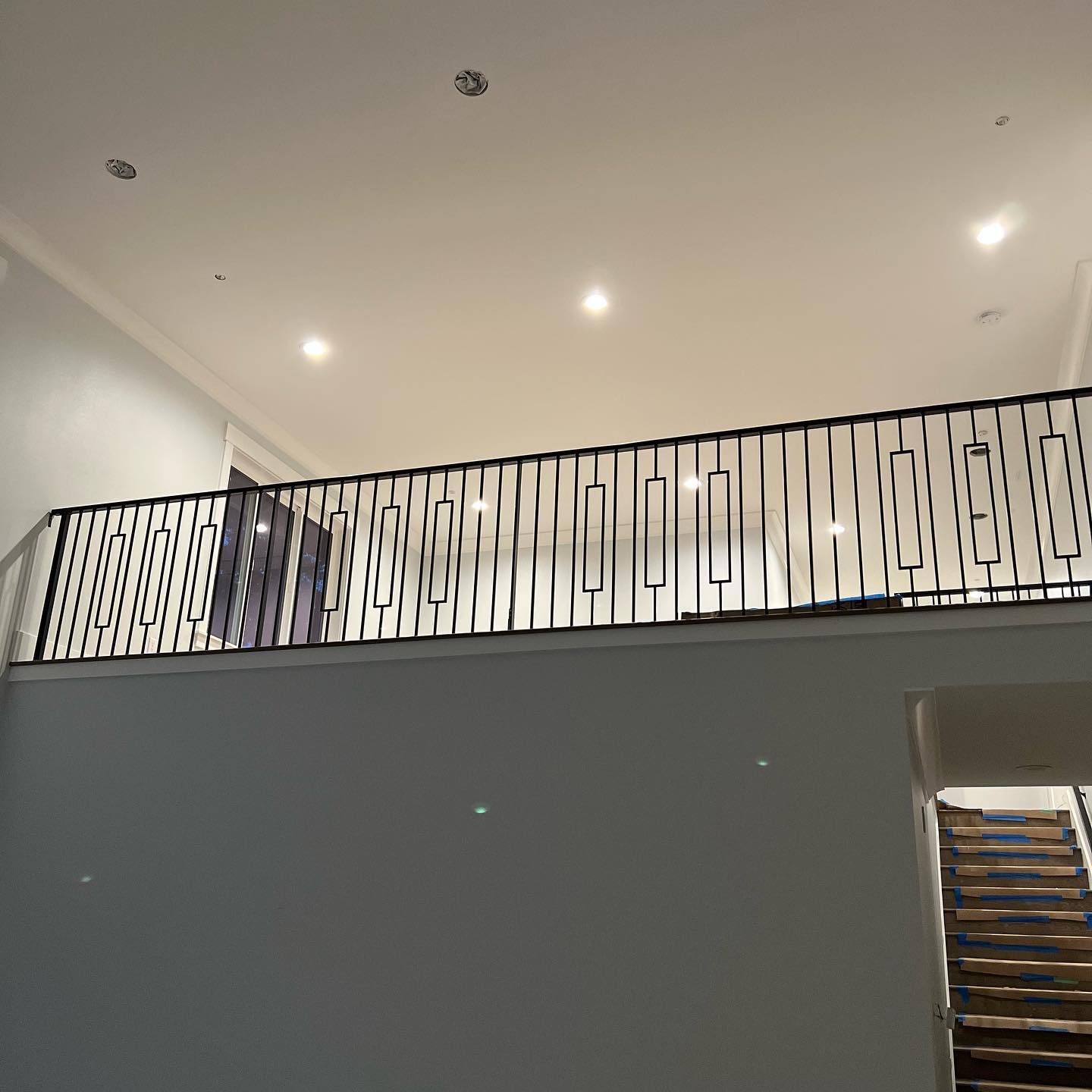 Modern black horizontal stair railings with clean lines and minimalist interior design